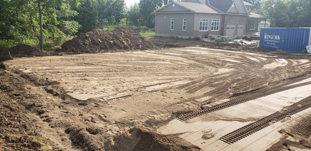 Large sand mound filter bed prepared for stone layer in Ancaster, Ontario