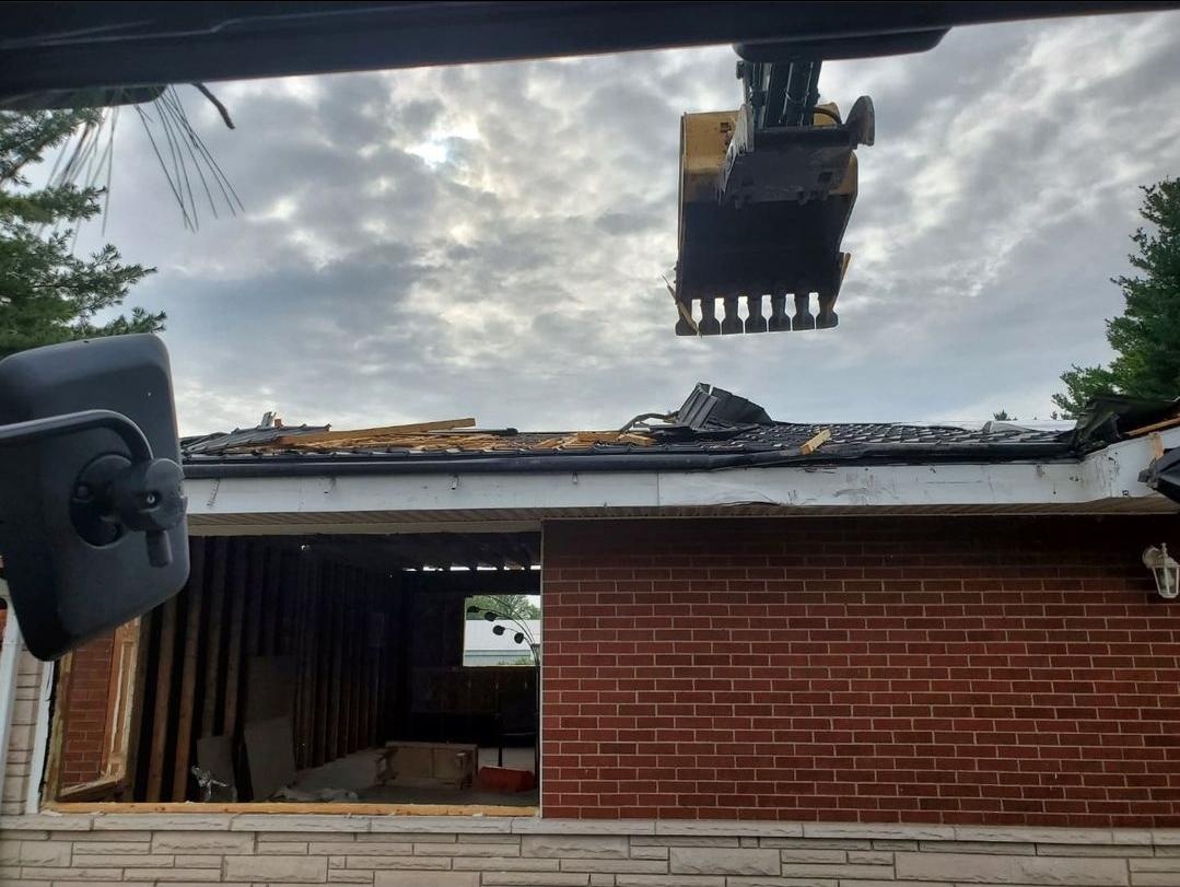 Excavator operator preparing for professional residential home demolition in Ancaster