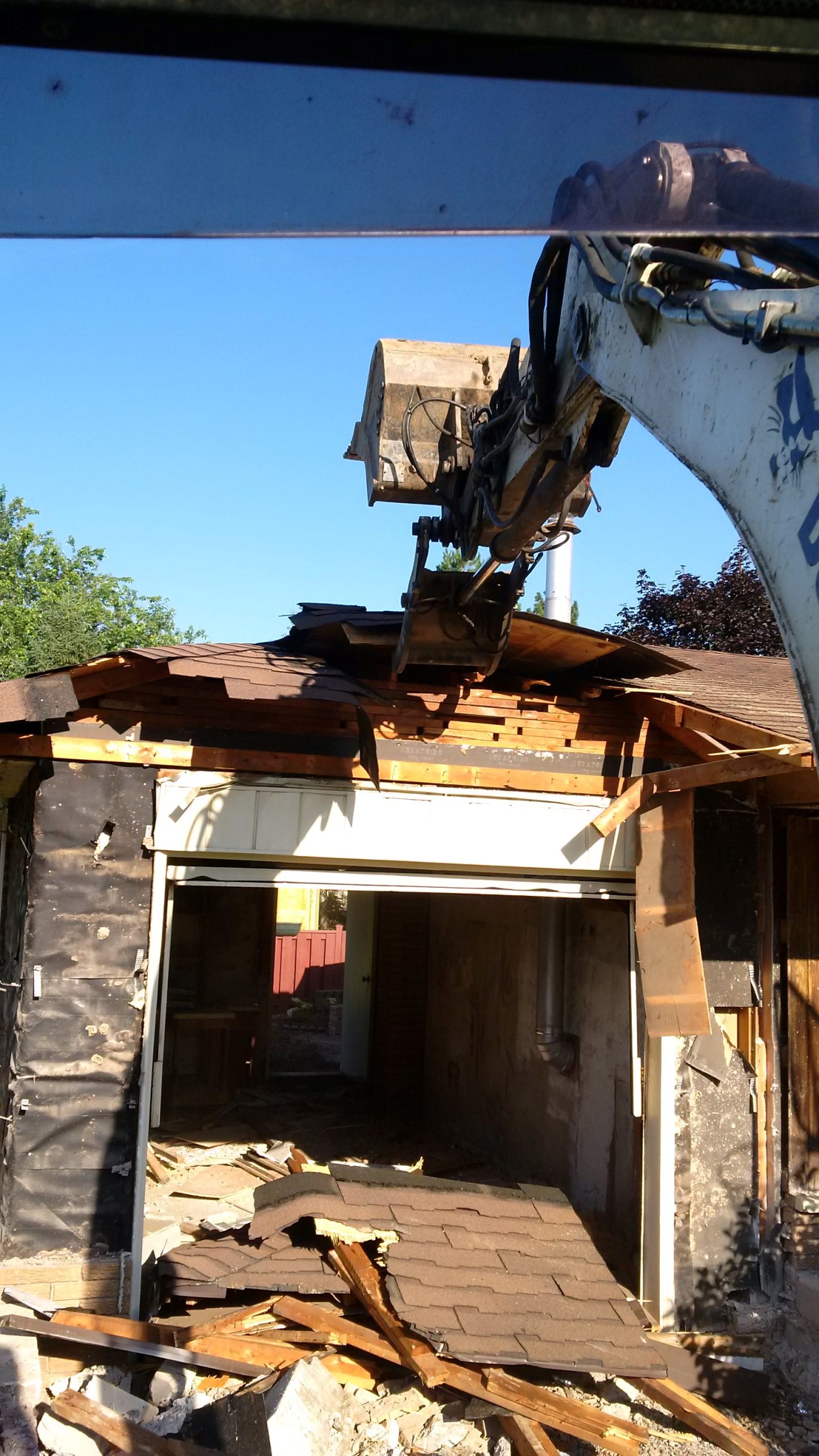 Garage demolition in Hamilton with safe debris removal