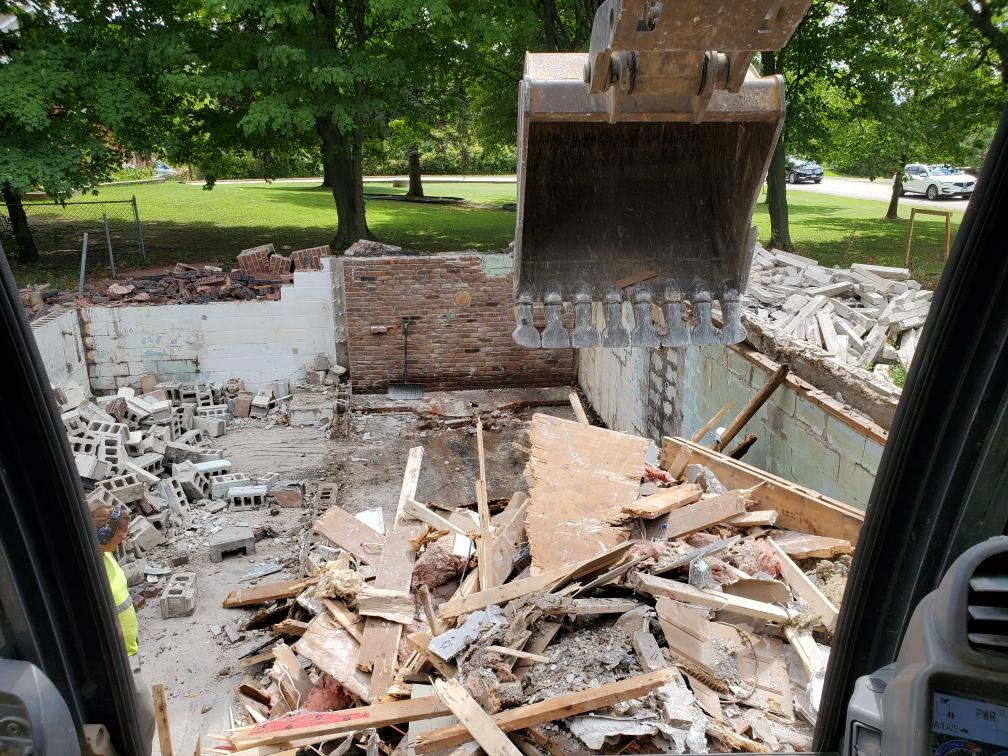 Alpha Ex demolition operators maintaining a tidy job site and recycling demolition materials