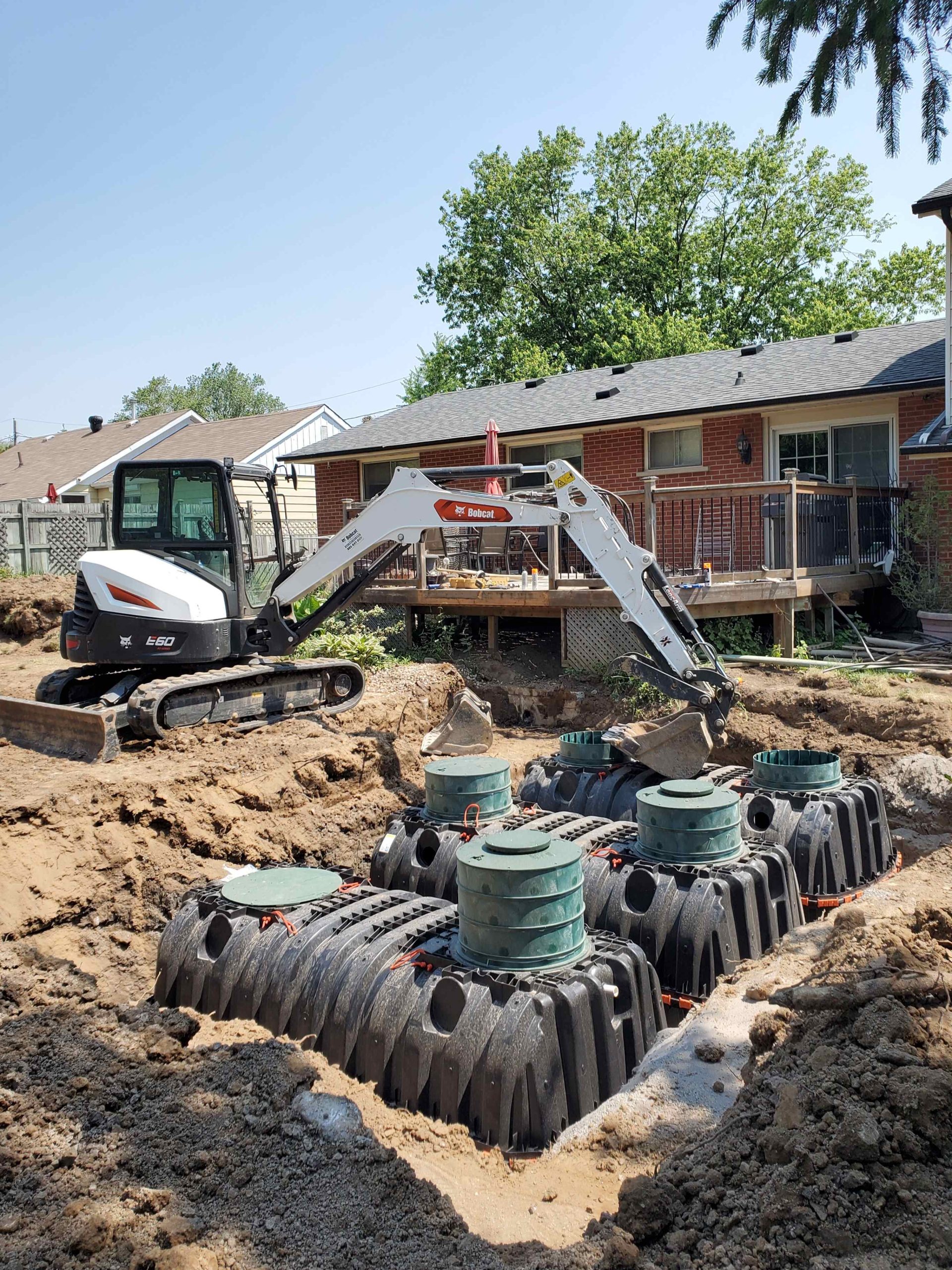 Installation of plastic tanks, Bionest treatment units, and flow balancing systems in Hamilton