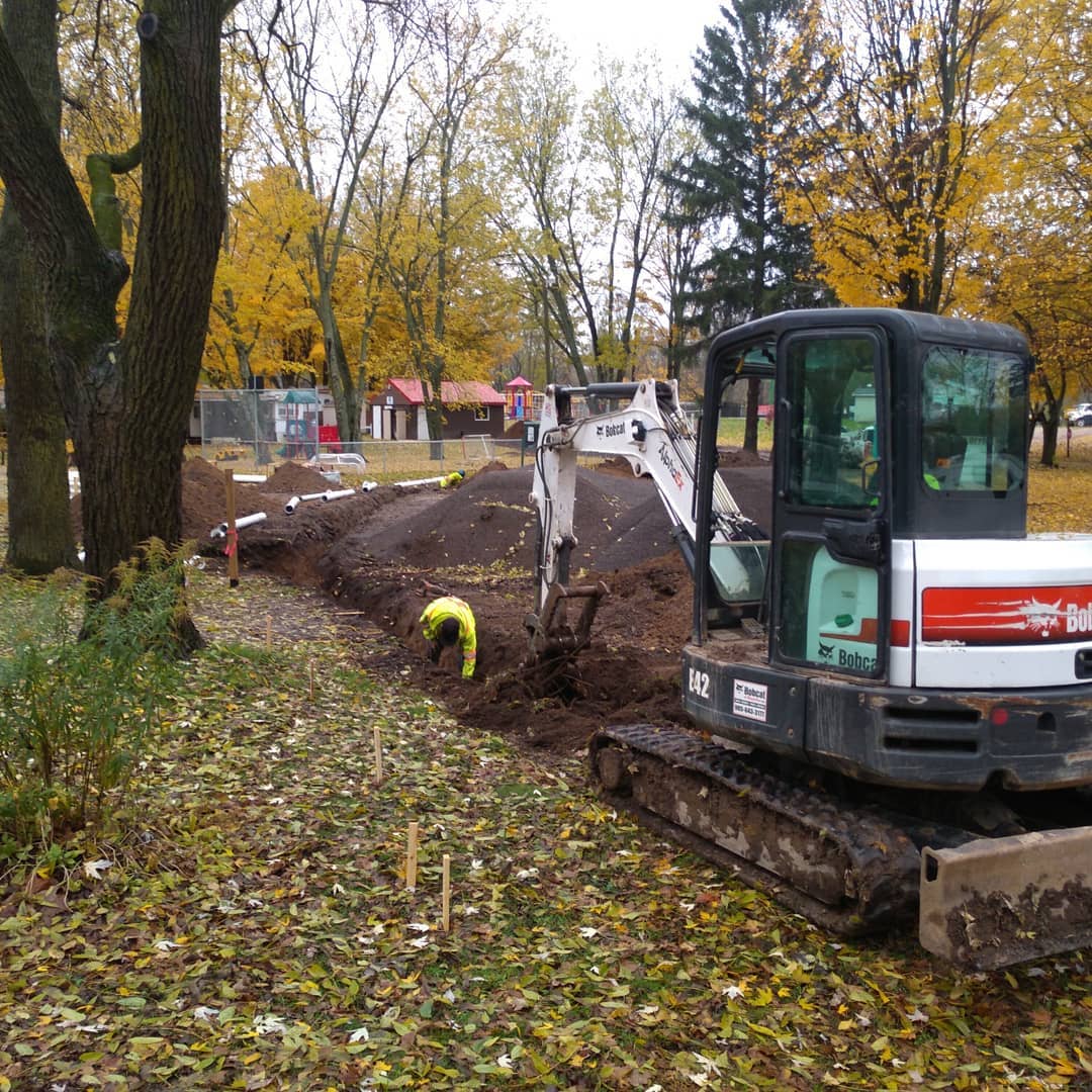 Septic and sewer collection line installed above the frost line in Haldimand with measures to prevent freezing.