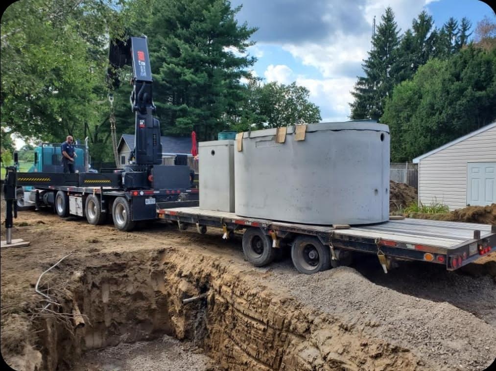 Septic tanks and pump chambers delivered by crane truck in Burlington, Ontario