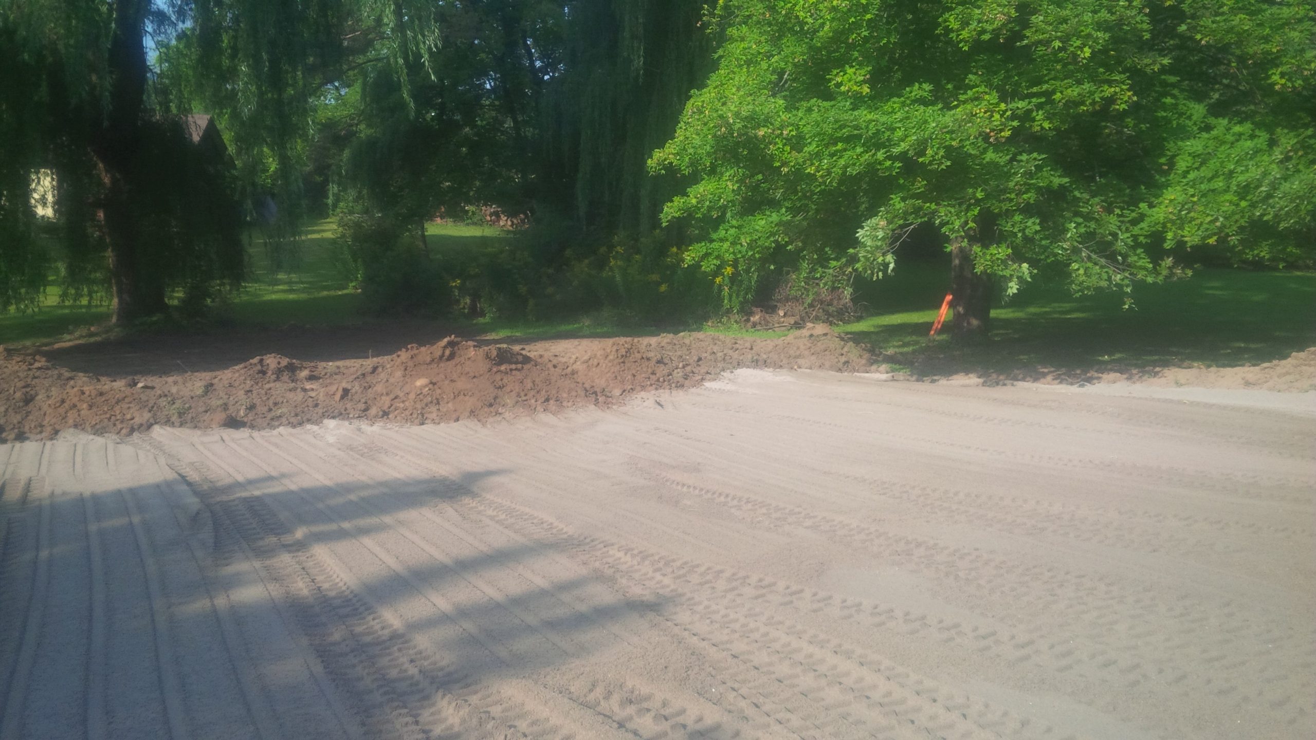 Septic bed sand mantle with topsoil being spread in Dundas, Ontario