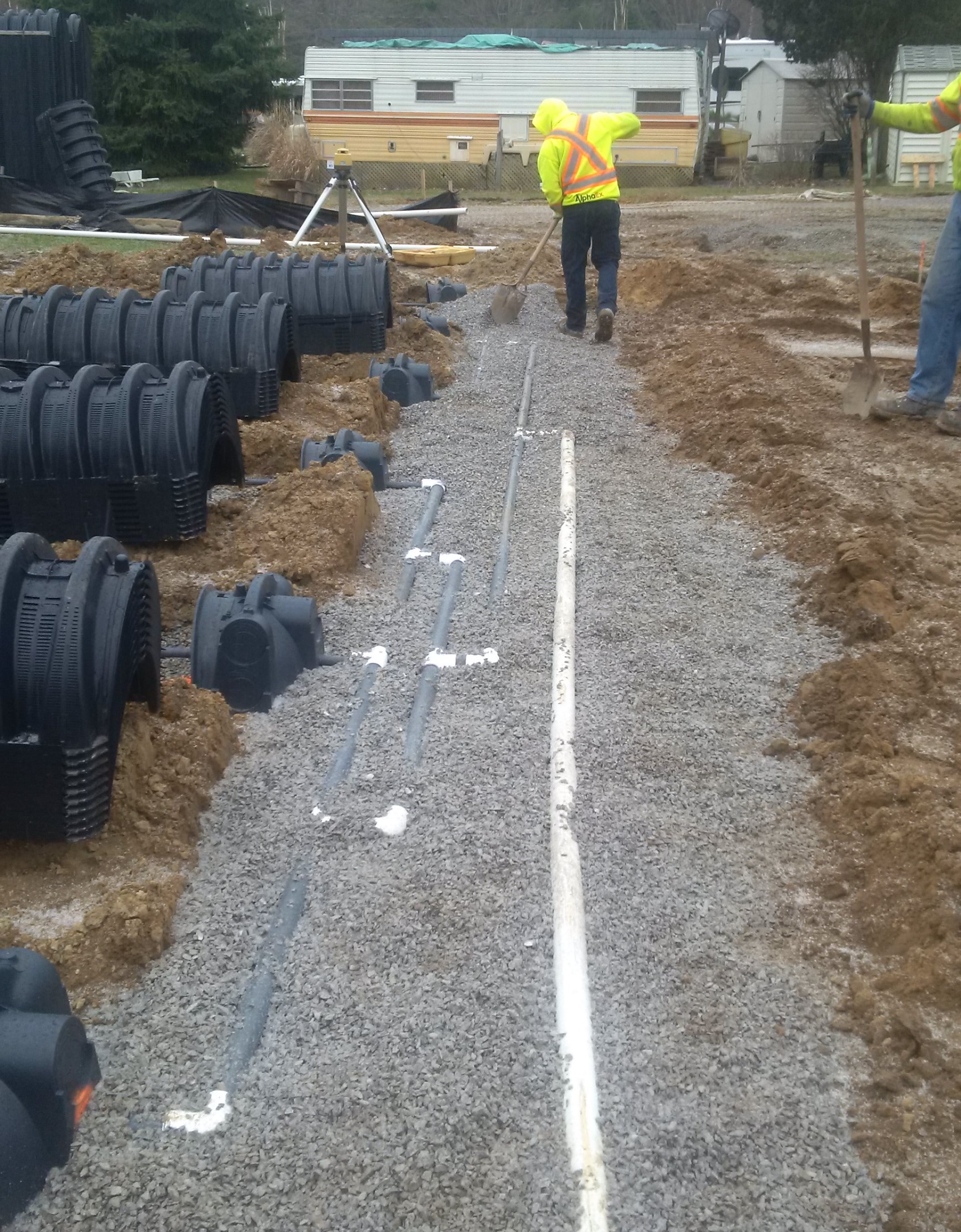 Shallow buried trench septic bed header in Norfolk with RH2O design for even effluent distribution across the entire cell.