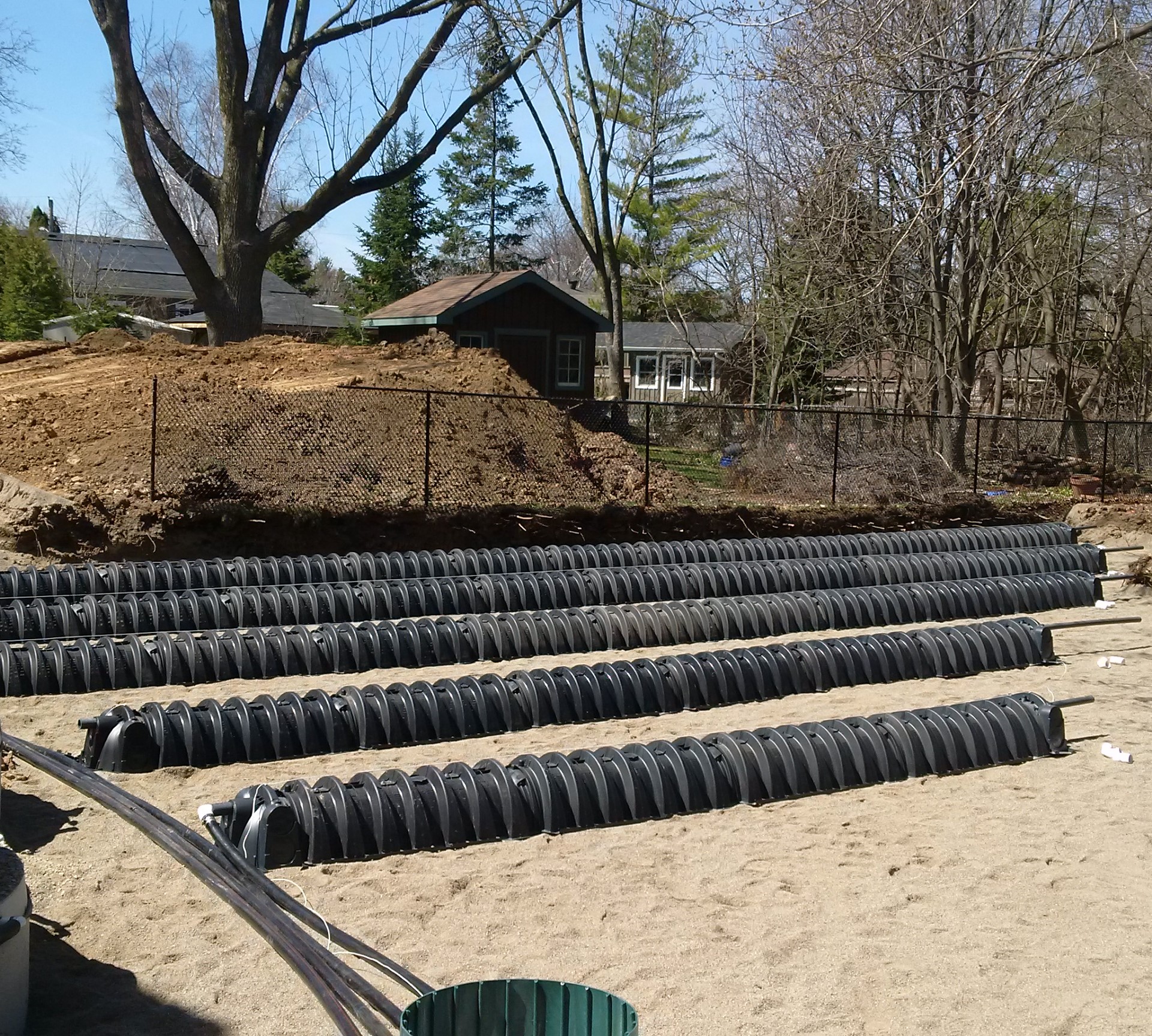 Urban shallow buried trench leaching bed in Burlington using variable absorption trench lengths under an alternative OBC solution.