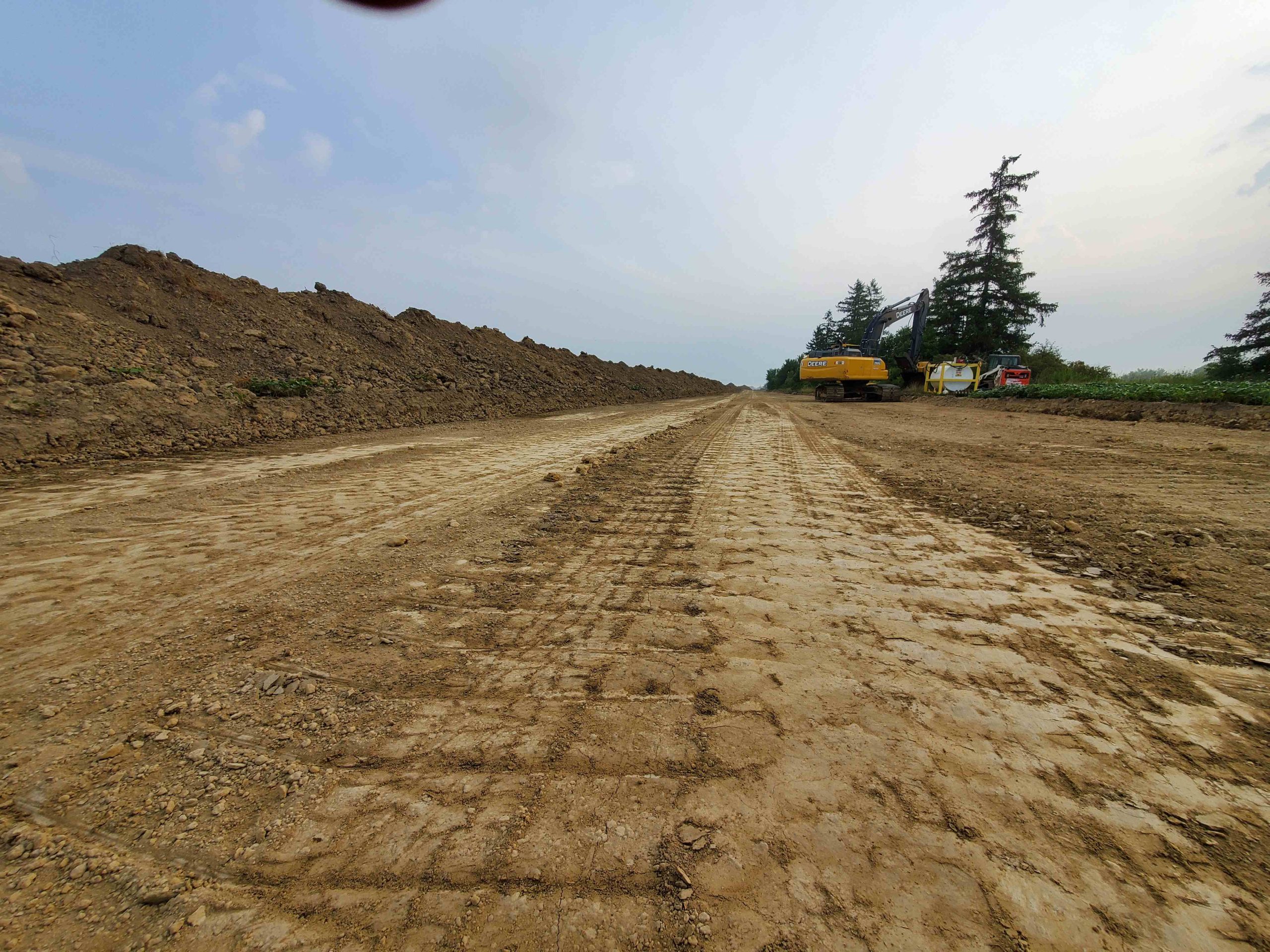 Excavation and land clearing for road building in Haldimand